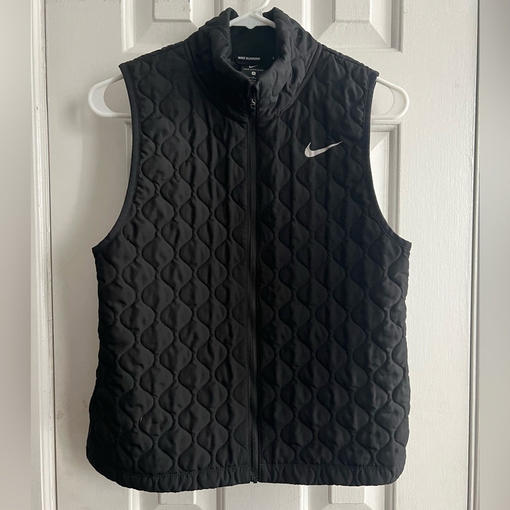 Black Nike vest.